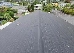 Dark gray asphalt shingle roof with dimensional shingles installed on residential home