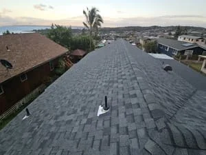 Gray dimensional asphalt shingles installed on pitched residential roof with clean alignment