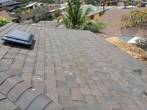 Asphalt shingle roof with gray dimensional shingles and roof penetration flashing