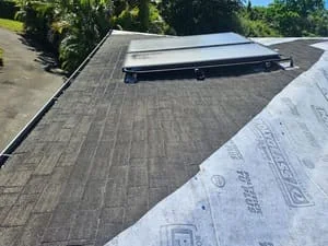 Asphalt shingle roof installation with gray dimensional shingles and roof vent flashing