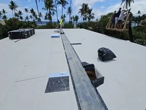White membrane flat roof with metal flashing, trim, and drainage system installation