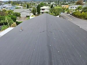 Charcoal gray asphalt shingle roof with roof vents and clean installation lines